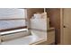 Spacious bathroom with a soaking tub and a separate tiled shower area at 210 Cheshire Way, Davenport, FL 33897