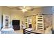 Large bedroom with accent wall, closet doors, side table, twin beds, and decorative pillow at 210 Cheshire Way, Davenport, FL 33897