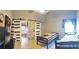 Large bedroom with accent wall, closet doors, side table, twin beds, decorative pillow, and ensuite bath at 210 Cheshire Way, Davenport, FL 33897