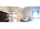 Bedroom offering a view to the bathroom behind the sliding barn doors at 210 Cheshire Way, Davenport, FL 33897