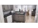 Bright eat-in kitchen with stainless steel appliances, tile flooring, and lots of cabinets at 210 Cheshire Way, Davenport, FL 33897