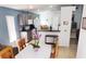 Bright eat-in kitchen with stainless steel appliances, tile flooring, and lots of cabinets at 210 Cheshire Way, Davenport, FL 33897