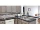 Bright eat-in kitchen with stainless steel appliances, tile flooring, and lots of cabinets at 210 Cheshire Way, Davenport, FL 33897