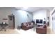 Open living room featuring comfortable seating, skylight, and entertainment center at 210 Cheshire Way, Davenport, FL 33897