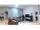 Cozy living room with vaulted ceilings, tile floors, and neutral wall colors at 210 Cheshire Way, Davenport, FL 33897