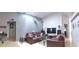 Open living room featuring comfortable seating, vaulted ceilings, and bright light at 210 Cheshire Way, Davenport, FL 33897