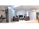 Open living room featuring comfortable seating, vaulted ceilings, and bright light at 210 Cheshire Way, Davenport, FL 33897