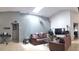 Open living room featuring a skylight, vaulted ceilings and comfortable seating at 210 Cheshire Way, Davenport, FL 33897