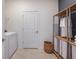 Convenient laundry room complete with modern appliances and ample storage space at 3069 Windswept Way, Wildwood, FL 34785
