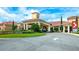 View of the clubhouse, featuring a stunning entrance and meticulous landscaping at 3205 Sonesta Ct # B, Clermont, FL 34711