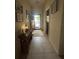 Inviting hallway featuring tile flooring, decor, and an entryway door, enhancing the home's aesthetic appeal at 3205 Sonesta Ct # B, Clermont, FL 34711