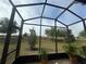 Screened-in patio overlooking the spacious backyard with tiled flooring and beautiful greenery at 3205 Sonesta Ct # B, Clermont, FL 34711