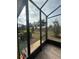 View of the screened-in patio showing tiled flooring and entrance door at 3205 Sonesta Ct # B, Clermont, FL 34711