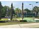 Shuffleboard courts with well-maintained landscaping and bench seating under decorative streetlights at 3205 Sonesta Ct # B, Clermont, FL 34711