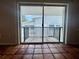 View of the outside balcony through sliding glass doors highlighting the outdoor space at 1550 11Th Ne St # G8, Winter Haven, FL 33881
