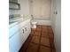 Clean bathroom featuring tile flooring, a single vanity, standard toilet, and a shower-tub combo at 1550 11Th Ne St # G8, Winter Haven, FL 33881