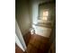 Compact bathroom featuring a toilet, sink with vanity, and tiled floors at 1550 11Th Ne St # G8, Winter Haven, FL 33881
