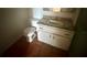 Cozy bathroom features a toilet, sink with vanity, and tiled floors at 1550 11Th Ne St # G8, Winter Haven, FL 33881