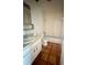 Compact bathroom with a single vanity, standard toilet, and a shower-tub combo with tile surround at 1550 11Th Ne St # G8, Winter Haven, FL 33881