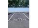 Reserved parking space marked as 'G8 PRIVATE' in a well-maintained lot at 1550 11Th Ne St # G8, Winter Haven, FL 33881