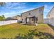 Large backyard with a gazebo, white privacy fence, and ample space for outdoor activities at 2448 Brownwood Dr, Mulberry, FL 33860