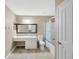 Spacious bathroom featuring a vanity with drawers and a shower-tub combo at 2448 Brownwood Dr, Mulberry, FL 33860