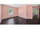 Bedroom with hardwood flooring, a window and pink walls at 2448 Brownwood Dr, Mulberry, FL 33860