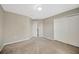 A beige carpeted bedroom with a closet and a single light fixture at 2448 Brownwood Dr, Mulberry, FL 33860