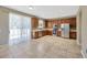 Open-concept kitchen with stainless appliances, wood cabinets, and natural light perfect for cooking and dining at 2448 Brownwood Dr, Mulberry, FL 33860