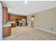 Efficient kitchen with stainless steel appliances, mosaic backsplash, and spacious tile flooring for easy maintenance at 2448 Brownwood Dr, Mulberry, FL 33860