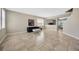 Open floor plan featuring tile flooring, neutral decor, and seamless transition to adjacent rooms at 2448 Brownwood Dr, Mulberry, FL 33860