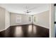 Bright living room with multiple windows and a ceiling fan, showcasing a spacious interior layout at 2448 Brownwood Dr, Mulberry, FL 33860