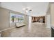 Spacious living room featuring tile floors, lots of light and a large kitchen, perfect for entertaining at 2448 Brownwood Dr, Mulberry, FL 33860