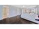 Spacious main bedroom with wood floors and access to the Primary bath and walk-in closets at 2448 Brownwood Dr, Mulberry, FL 33860
