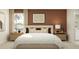 Inviting bedroom with a plush bed, stylish bedside tables with lamps, and contemporary decor at 1373 Acorn Meadow Loop, Eustis, FL 32726