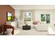 Cozy living room with a comfortable L-shaped sofa, modern decor, and access to the outdoor patio at 1373 Acorn Meadow Loop, Eustis, FL 32726