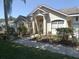Well-maintained home with a beautiful front yard and attractive landscaping at 566 Montana Ave, Davenport, FL 33897