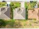 Aerial view of houses displaying various roof shapes and neatly trimmed lawns at 2522 Pine Valley Dr, Lakeland, FL 33810