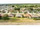 A neighborhood aerial shot reveals tree lined streets and well-maintained homes at 2522 Pine Valley Dr, Lakeland, FL 33810