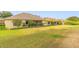 Spacious backyard featuring a well-maintained lawn and screened-in patio, perfect for outdoor relaxation and entertaining at 2522 Pine Valley Dr, Lakeland, FL 33810