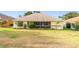Wide backyard with well-maintained lawn, lovely trees, and bushes at 2522 Pine Valley Dr, Lakeland, FL 33810
