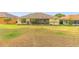 Spacious backyard with lush grass, colorful foliage, and a private, tranquil setting at 2522 Pine Valley Dr, Lakeland, FL 33810