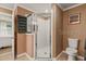 Well-lit bathroom featuring a glass shower with neutral-tone walls and coordinated towels at 2522 Pine Valley Dr, Lakeland, FL 33810