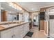 Elegant bathroom featuring a double vanity, walk-in shower, and abundant storage at 2522 Pine Valley Dr, Lakeland, FL 33810