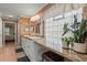 Bathroom boasts double sinks, granite countertop, a vanity table with stool, and plenty of natural light at 2522 Pine Valley Dr, Lakeland, FL 33810