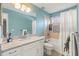 Bright bathroom with marble countertop, white cabinets, and tub shower at 2522 Pine Valley Dr, Lakeland, FL 33810