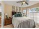 Bedroom featuring a wooden headboard, white bedding, and natural light at 2522 Pine Valley Dr, Lakeland, FL 33810