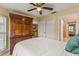 Bedroom featuring wooden armoire, neutral walls, plush bedding, and bright natural light at 2522 Pine Valley Dr, Lakeland, FL 33810