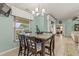 Cozy breakfast nook boasts natural light and views, complemented by a granite table and seating at 2522 Pine Valley Dr, Lakeland, FL 33810