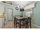 Inviting dining area featuring a granite table with chandelier lighting and views of the backyard at 2522 Pine Valley Dr, Lakeland, FL 33810